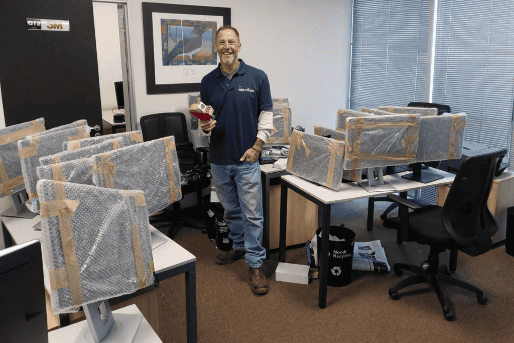 Professional office moving team preparing computer equipment for relocation, top-rated movers in South Africa.
