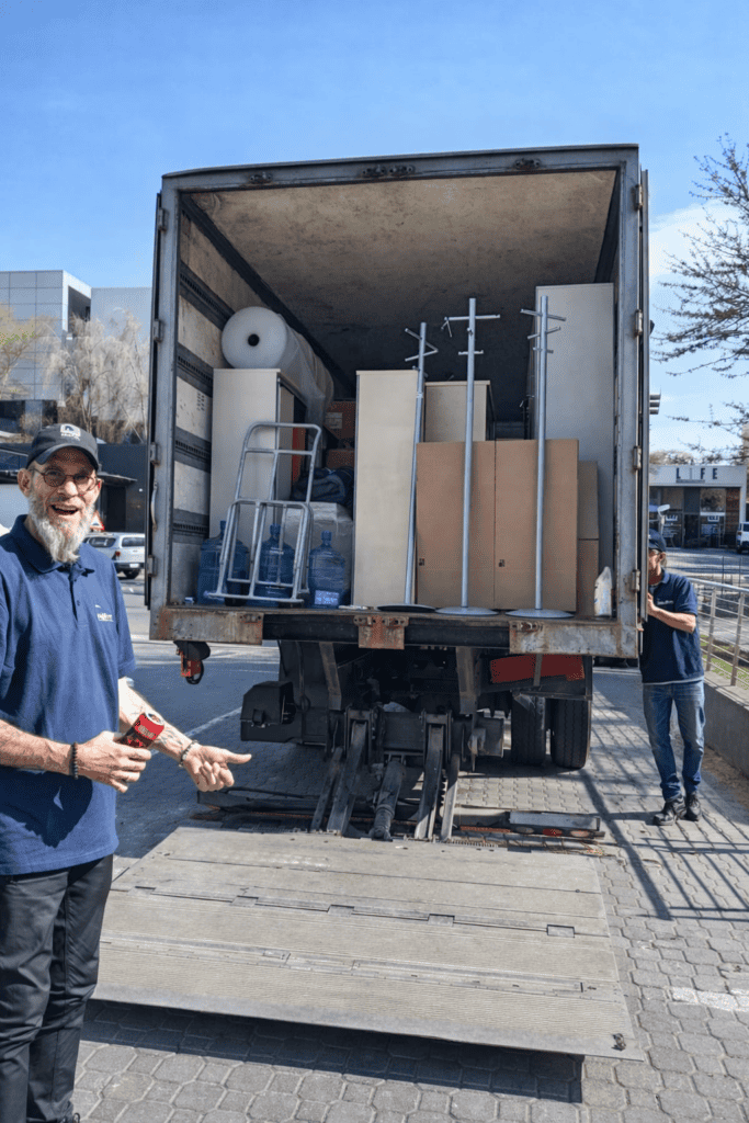 Heavy-duty moving truck loaded with office furniture and equipment by MGS Movers.